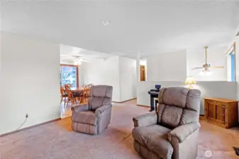 Living room opens toward dining area & kitchen for easy everyday living.