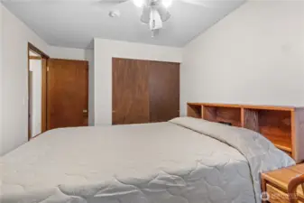 Second view of upstairs bedroom showing closet storage.
