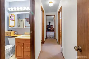 Downstairs hallway connecting bedroom, bathroom & red room.