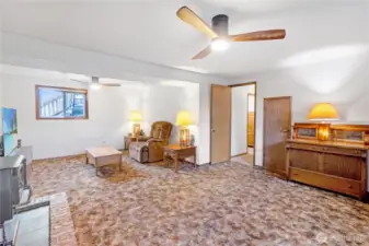 Large downstairs living area offering flexible space for media, hobbies or gatherings.