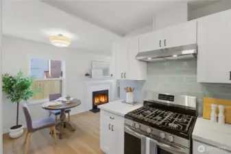 Kitchen with gas range and direct connection to living space