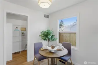 Dining area with natural light and easy access to kitchen