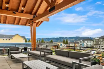 Cozy outdoor fireplace seating w/stunning westerly views.