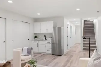 Kitchenette features quartz counters, sink and bar fridge icluded. Potential ADU with washer dryer hoous in closet.