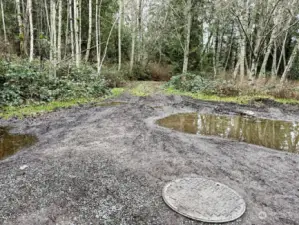 Sewer manhole at start of drive