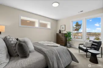 The second guest suite downstairs offers complete privacy, featuring a private bathroom, a full closet system, and fantastic views—making it an ideal retreat for guests.