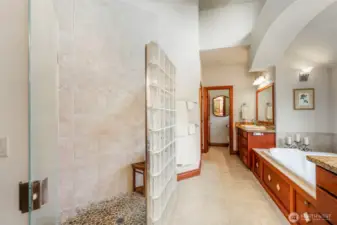 From the shower end, looking towards the soaking tub and separate vanity.
