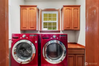 Laundry room included newer washer and dryer set.