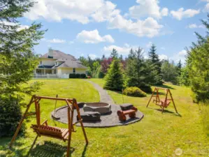 Custom fire pit area with Olympic Mountain views.