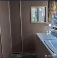 Laundry area has a separate access from the covered patio.