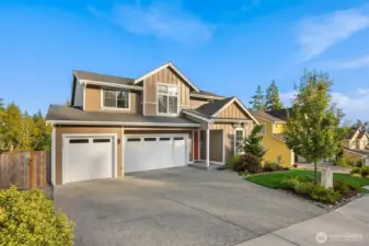 Enjoy ample storage with this 3 car garage complete with an electric car outlet and wall mounted storage cabinets.