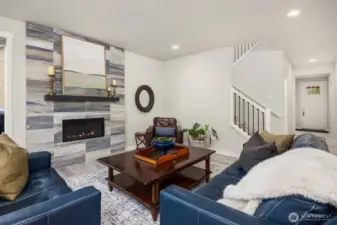 Cozy up this Fall to the floor to ceiling tile fireplace that beautifully anchors the living room.