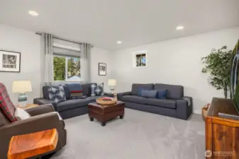 A spacious family room welcomes you to the 2nd floor