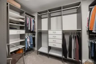 No need to purge with this sizable walk-in closet complete with drawers for added storage.