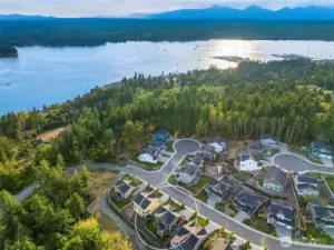 The Crystal View community sits at the top edge of the plateau allowing homes to capture territorial views of the trees, Liberty Bay and Mt. Rainier in the distance.