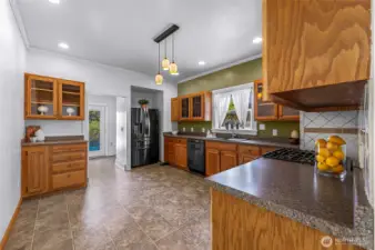 Large kitchen space with room for a small table and chairs if you want in kitchen seating