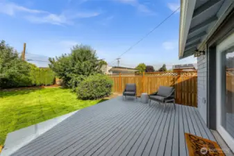 Back deck off of laundry room with beautiful back yard