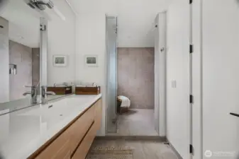 The shared upstairs bathroom has a private water closet and a huge walk in shower