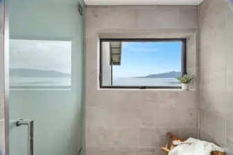 This shower feels like you have walked into a spa and has bay views as well!