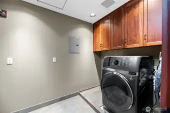 Primary room laundry off the bathroom. Washer and dryer combo.