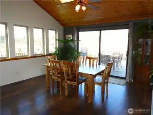 Large dining room connecting to wraparound deck.