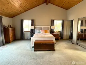 Oversized primary bedroom with connecting door to the deck.