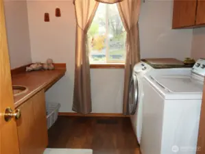 Half-bath/laundry room.