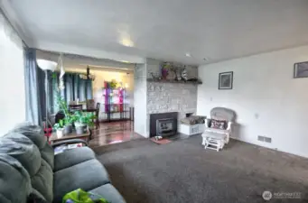 Welcoming entrance with woodstove insert.