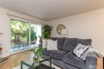 Large slider door steps out to a charming sitting patio, perfect to sip your morning coffee, afternoon tea or your favorite evening beverage.