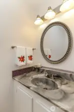 Convenient half bath located on main level.