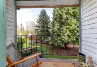 Peaceful and serene views from upper-level balcony off the primary bedroom.