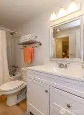 Full bath serving both bedrooms.