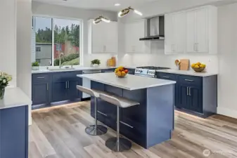 Kitchen with breakfast bar and gas cooktop