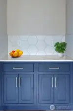 Built in cabinetry adds a touch of luxury to this spacious dining area