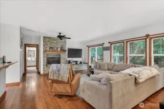 Unit A - Living room space with access to the backyard - lots of windows allowing in the natural light & territorial views.