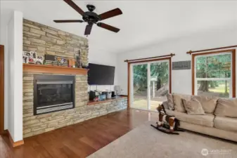 Unit A - Living space with fireplace and access to the backyard.