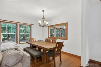 Unit A - Dining space which is open to the living w/fireplace - lots of windows allowing the natural light into the home.