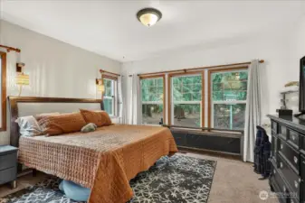 Unit A - Spacious primary bedroom with with WIC, full bathroom & lots of natural light.