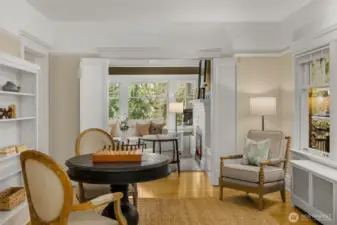 The family room floors from the living room with French doors to divide them.