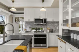 The kitchen has plenty of room for multiple chefs and people visiting with the chefs.