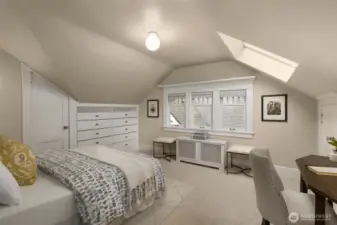 Upstairs bedroom 2 with skylight.