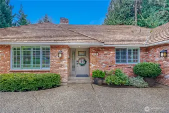 Front view of home. Well maintained brick siding & wood siding