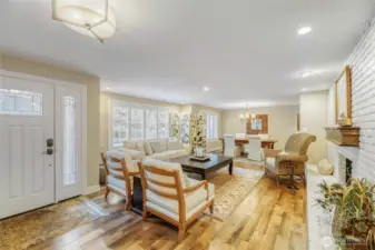 Beautiful vinyl hardwood flooring. Brick fireplace converted to gas. Plantation shutters on windows in living and dining room.