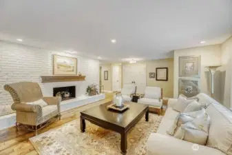 Lliving room from dining room view, Showing full brick gas fireplace.