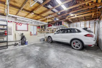 Garage has storage in attic area and additional wire rack storage.