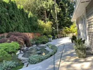 View of patio in summer.  Swing will stay with home.