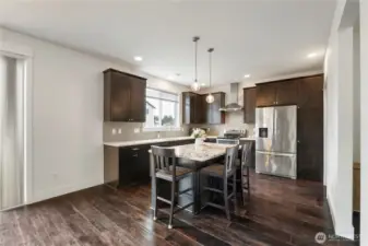 Modern kitchen with a  island and rich wood cabinetry