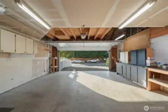 Large 2 car garage offering great additional storage above in the attic. The  garage door is newer.