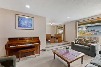 Large windows fill the room with natural light.