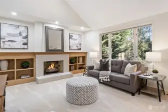 Large family room with new carpet, gas fireplace and gorgeous view of the back yard.